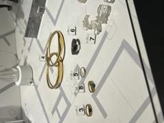 Ancient jewelry from Herculaneum displayed on a white cloth