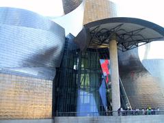 Guggenheim Museum Bilbao exterior with blue sky