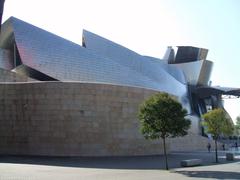 Guggenheim Museum Bilbao exterior with modern architecture and reflective water pool