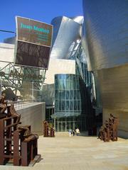 Guggenheim Museum Bilbao modern architectural building with reflective glass and curved titanium panels
