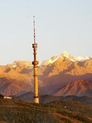 Sunset view over Koktobe hill in Almaty, Kazakhstan with cityscape and mountains