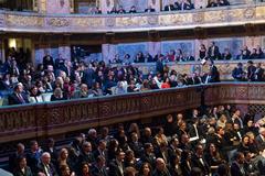 First Lady Melania Trump attending a musical performance hosted by Brigitte Macron at the Royal Opera House in the Palace of Versailles