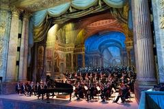 Symphony orchestra performing at Royal Opera House Versailles for First Lady Melania Trump and Brigitte Macron