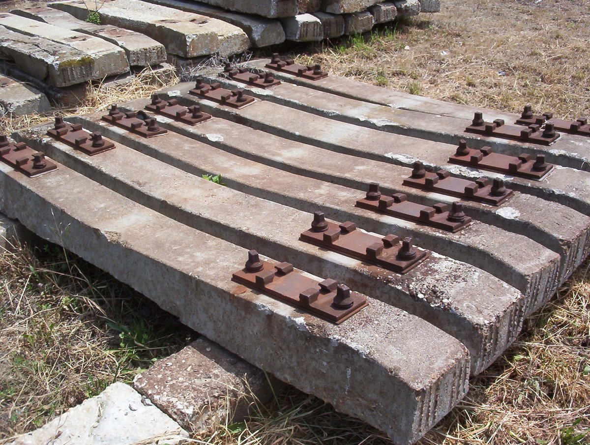 Stack of reinforced concrete sleepers labeled 'LM' in Soroksár