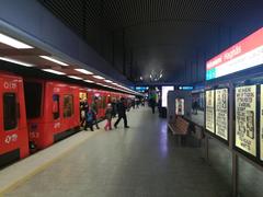 Hakaniemi metro station in Helsinki Finland interior with yellow tiled walls and escalators