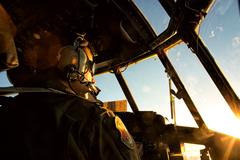 U.S. Air Force pilot Capt. Chance Hansen in cockpit of C-130 Hercules during formation flight over Japan