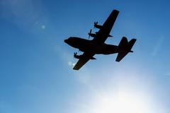 U.S. Air Force C-130 Hercules aircraft flying over Yokota Air Base Japan transporting Airmen returning from deployment