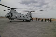 U.S. Marines and Sailors boarding CH-46 Sea Knight Helicopter at Yokota Air Base for Sendai relief mission
