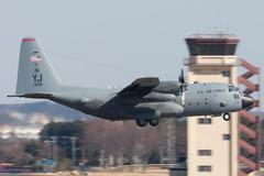 U.S. Air Force C-130 Hercules aircraft taking off from Yokota Air Base in Japan