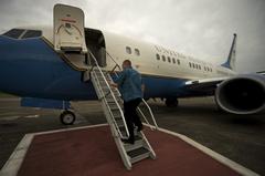 Deputy Secretary of Defense Bob Work boarding aircraft at Yokota Air Base Japan