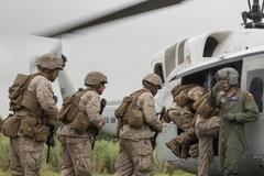 U.S. Air Force Staff Sgt. Nicholas Poe loading Marines during Exercise Iron Fist at Camp Fuji