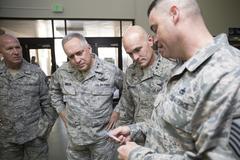 Master Sgt. David Burdick briefing Lt. Gen. Carlton D. Everhart II and Maj. Gen. Frederick Martin at Yokota Air Base passenger terminal