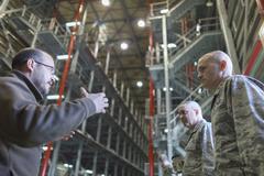 Maj. Gen. Frederick Martin and Lt. Gen. Carlton D. Everhart II being briefed by Ernie Weber at WestPac Transportation Facility Yokota Air Base
