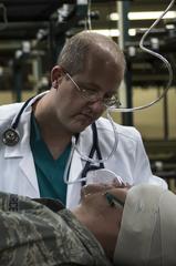 U.S. Air Force medical personnel practicing patient care in an expansion bay at Misawa Air Base, Japan