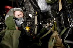 Master Sgt. Mike Milich testing emergency oxygen systems on MC-130P aircraft