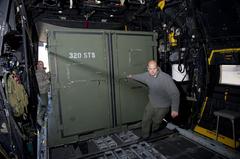 Members of the 17th Special Operations Squadron loading supplies onto MC-130P at Sendai Airport