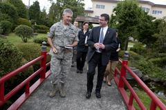 Deputy Secretary of Defense Ashton B. Carter walking with Air Force Lt. Gen. Sam Angeella at Yokota Air Base, Japan