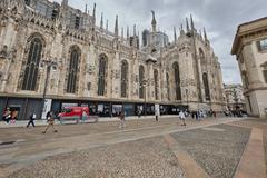 Facade of Milan Cathedral illuminated in daylight