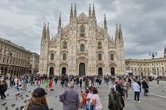 Cathedral of Milan illuminated at night with intricate gothic architecture