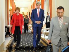 U.S. Secretary of State John Kerry walking with EU High Representative Catherine Ashton after meeting in Brussels