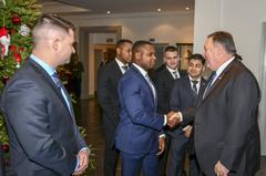 Secretary Pompeo shaking hands with a Marine Security Guard in Brussels