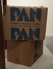 Boxes of the National Food Program displayed at an Argentine graphic design exhibition in MALBA