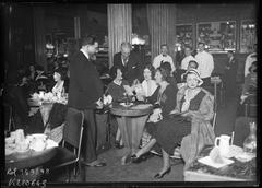 Four women at a stamp sale fundraising event for tuberculosis prevention at Le Lido cabaret-restaurant in Paris, 1931