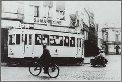 Vintage black and white photo of Ghent tram line 4 from Dampoort to the station with Kuipersstraat and the 19th century Stadsschouwburg facade