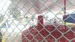 Empty amusement park with closed rides and deserted pathways