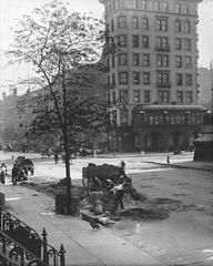 Northeast corner of 7th Avenue and 42nd Street in Manhattan showing Pabst Hotel and men working on the street with demolished buildings for subway construction