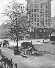 Northeast corner of 7th Avenue and 42nd Street in Manhattan with Pabst Hotel and men working on 7th Avenue