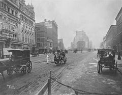 View of Longacre Square, Manhattan with former Hammerstein's Olympia complex including New York Theatre, Pabst Hotel in distance, and Hotel Cadillac at 43rd Street corner