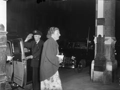 Princess Juliana arriving at the Stadsschouwburg theater in Amsterdam with Prince Bernhard for the first performance of the play '1948 ANNO CHRISTI' on September 2, 1948