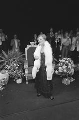 Actress Ank van der Moer standing and receiving applause at Amsterdam Stadsschouwburg during her 50th theater anniversary celebration