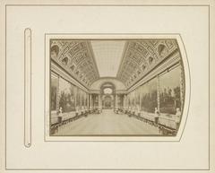 Galerie des Batailles interior at the Château de Versailles showing large historic battle paintings along spacious corridor walls