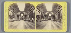 Interior view of the Galerie des Batailles corridor with ornate ceiling and wall paintings in the Palace of Versailles, France