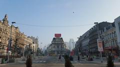 Place de Brouckère square in Brussels with historic buildings and street activity