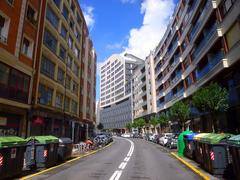 Alameda de Mazarredo street view in Bilbao with modern buildings and trees