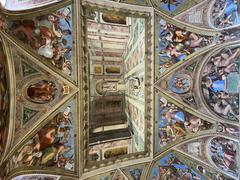 Ornate Vatican Museums ceiling with intricate frescoes and decorations