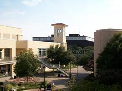 University of Texas at San Antonio campus showing University Center and Convocation Center buildings under a clear sky