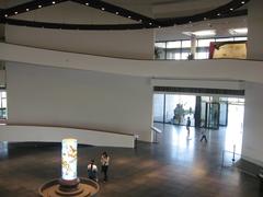 Stairway at the Hanoi Museum with modern architectural design and glass elements