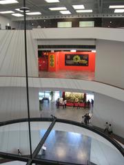 Stairway inside the Hanoi Museum with modern architectural design and glass railings