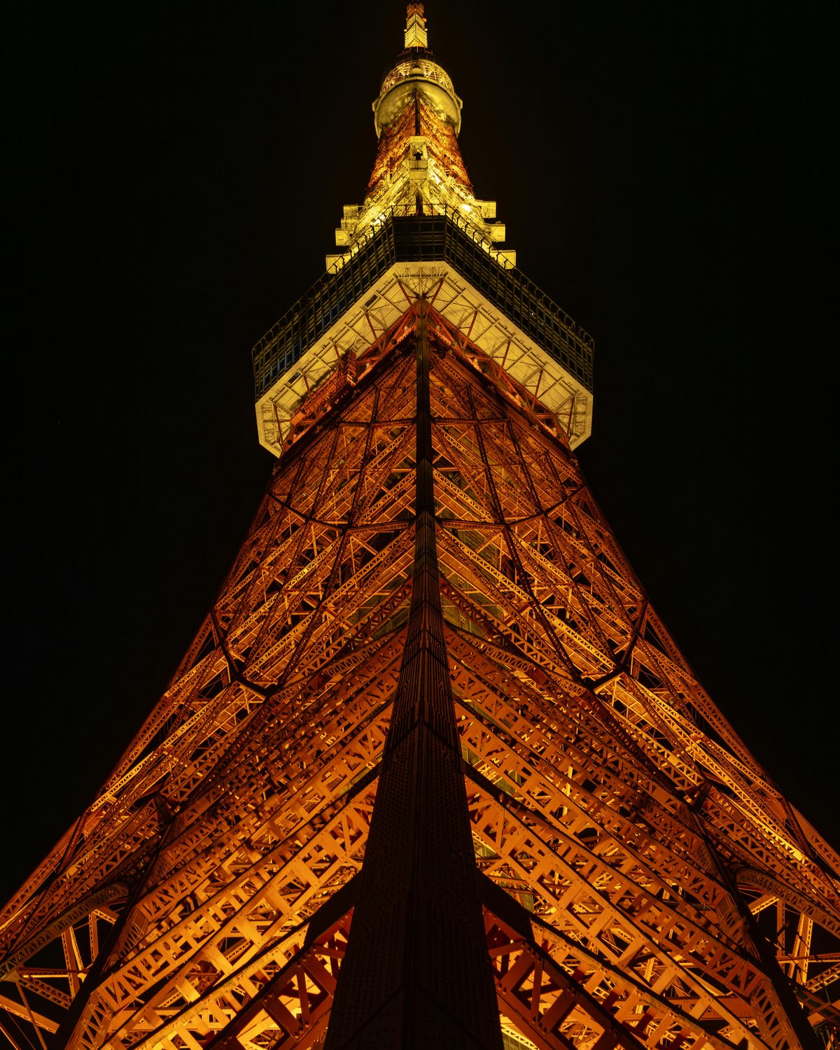 Dramatic night view of illuminated Tokyo Tower with city skyline