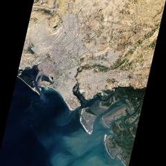 Aerial satellite image of Karachi, Pakistan showing urban areas, rivers, mangroves, and port on the Arabian Sea coast