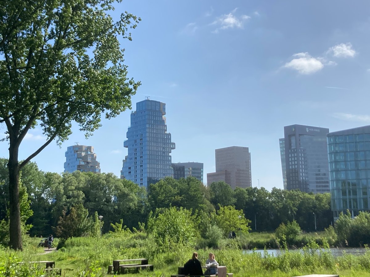 Modern high-rise buildings at Amsterdam ZuidAs De Valley during sunset
