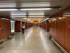 Křižíkova metro station platform with blue and white tiled walls and yellow safety line on platform edge