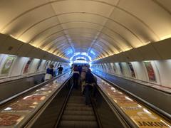 Křižíkova metro station platform with trains and tracks