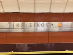 Křižíkova metro station interior with platforms and passengers