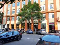 Street view with crosswalk, traffic lights, cyclist and cars in an urban area