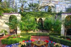 The Arch and scenic views in St. Louis botanical garden courtyard with temperate house